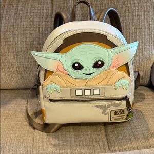 Star Wars Mandalorian’s child in cradle Backpack with Green and Brown Accents